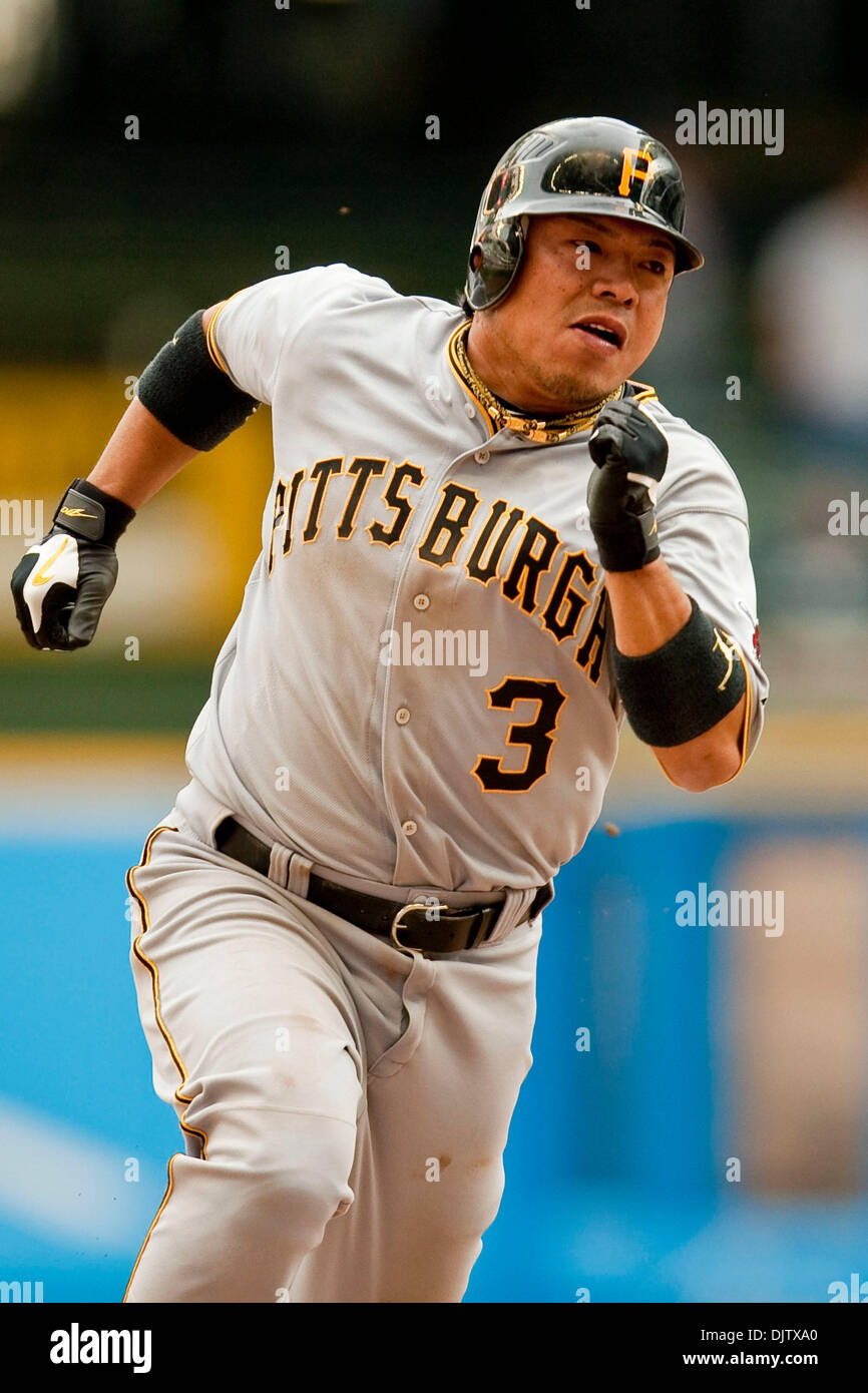 Pittsburgh Pirates second baseman Akinori Iwamura 3 rounds third base and heads for home