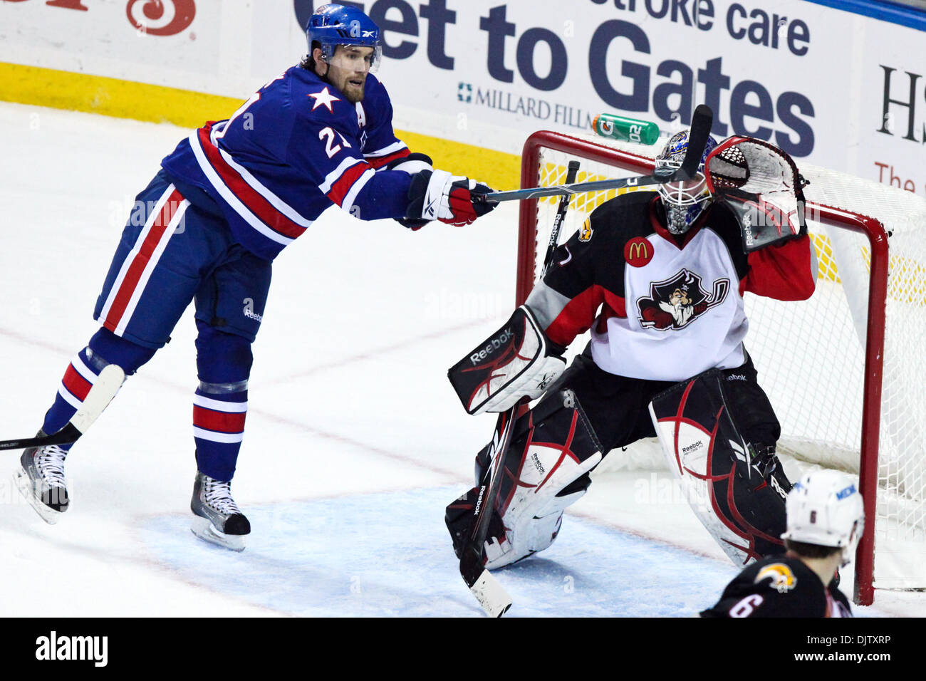 Rochester Americans Graham Mink (21) screens Portland Pirates goalie Jhonas  Enroth (1) in the second period. Rochester now leads the game 2-1 at HSBC  Arena in Buffalo, NY, USA; (Credit Image: ©