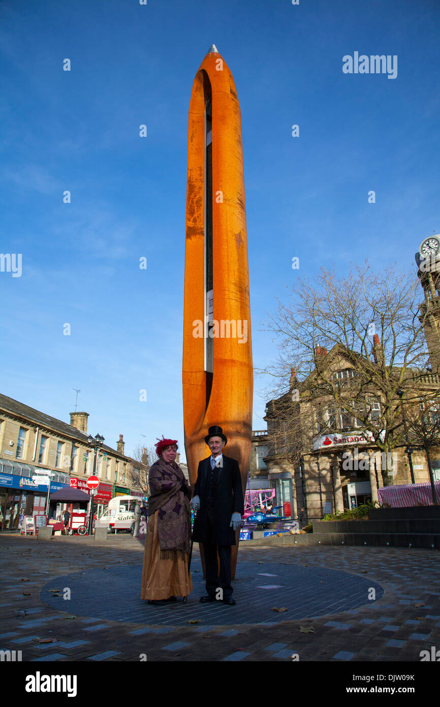 Nelson, Lancashire, UK. 30th November, 2013. Councillors Eileen Anser & Tony Edwards in front of the 12m high Weaving Shuttle. The Town of Nelson commemorates the day in 1295 when the county of Lancashire sent its first representatives to Parliament by King Edward I of England to attend what later became known as the model parliament.  Lancashire Day is usually held on 27 November, when many towns throughout the historic county host events on the day, most notably readings of the Lancashire Day Proclamation.  Credit:  Mar Photographics/Alamy Live News Stock Photo