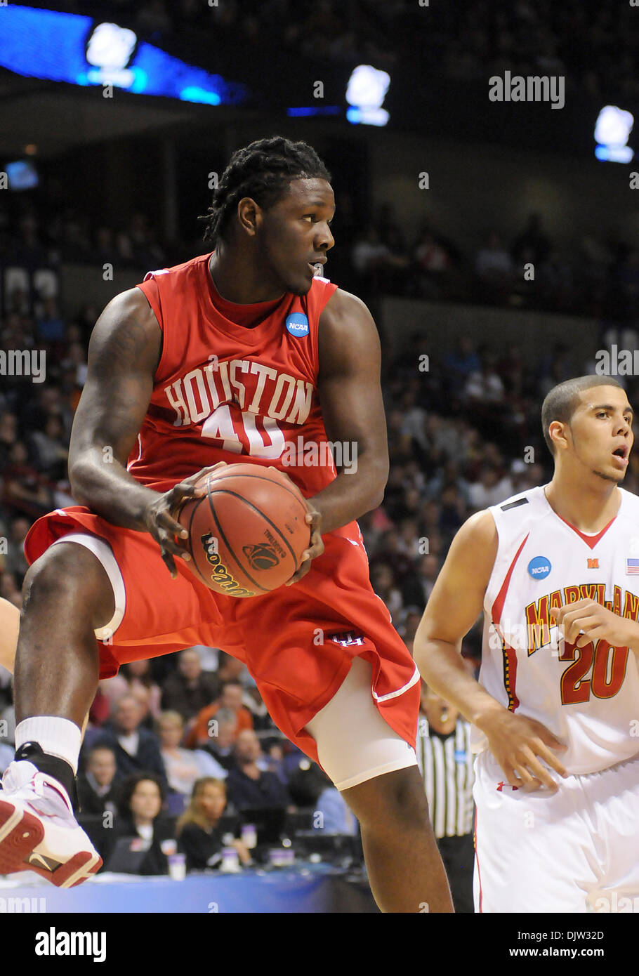 Houston's forward Kendrick Washington pulls down the rebound in front