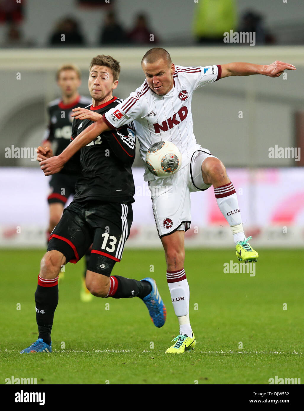 Leverkusen, Germany. 30th Nov, 2013. Nuremberg's Adam Hlousek (R) and Leverkusen's Jens Hegeler vie for the ball during the Bundesliga soccer match between Bayer o4 Leverkusen and 1. FC Nuremberg in the BayArena in Leverkusen, Germany, 30 November 2013. Photo: Rolf Vennenbernd/dpa (ATTENTION: Due to the accreditation guidelines, the DFL only permits the publication and utilisation of up to 15 pictures per match on the internet and in online media during the match.)/dpa/Alamy Live News Stock Photo