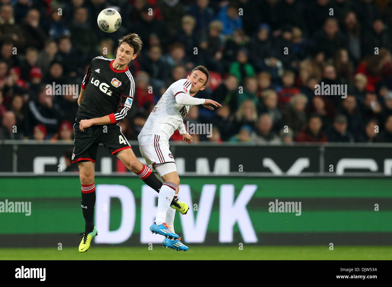Leverkusen, Germany. 30th Nov, 2013. Nuremberg's Josip Drmic (R) and Leverkusen's Philipp Wollscheid vie for the ball during the Bundesliga soccer match between Bayer o4 Leverkusen and 1. FC Nuremberg in the BayArena in Leverkusen, Germany, 30 November 2013. Photo: Rolf Vennenbernd/dpa (ATTENTION: Due to the accreditation guidelines, the DFL only permits the publication and utilisation of up to 15 pictures per match on the internet and in online media during the match.)/dpa/Alamy Live News Stock Photo