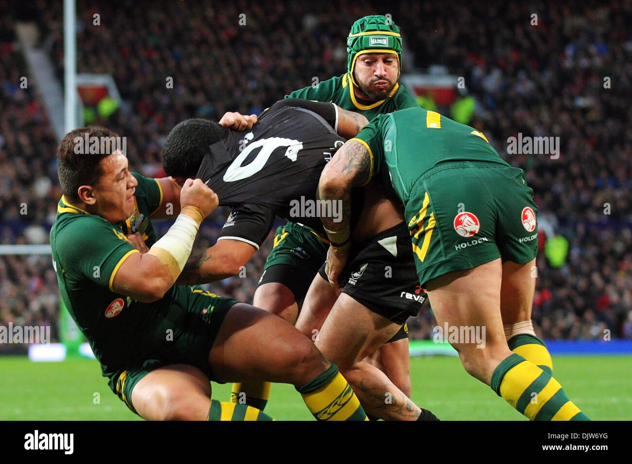 Manchester, UK. 30th Nov, 2013. Johnathan Thurston (Australia &amp; North Queensland Cowboys) tackles Isaac Luke (New Zealand &amp; South Sydney Rabbitohs) during the Rugby League World Cup Final between New Zealand and Australia at Old Trafford Manchester. Credit:  Action Plus Sports/Alamy Live News Stock Photo