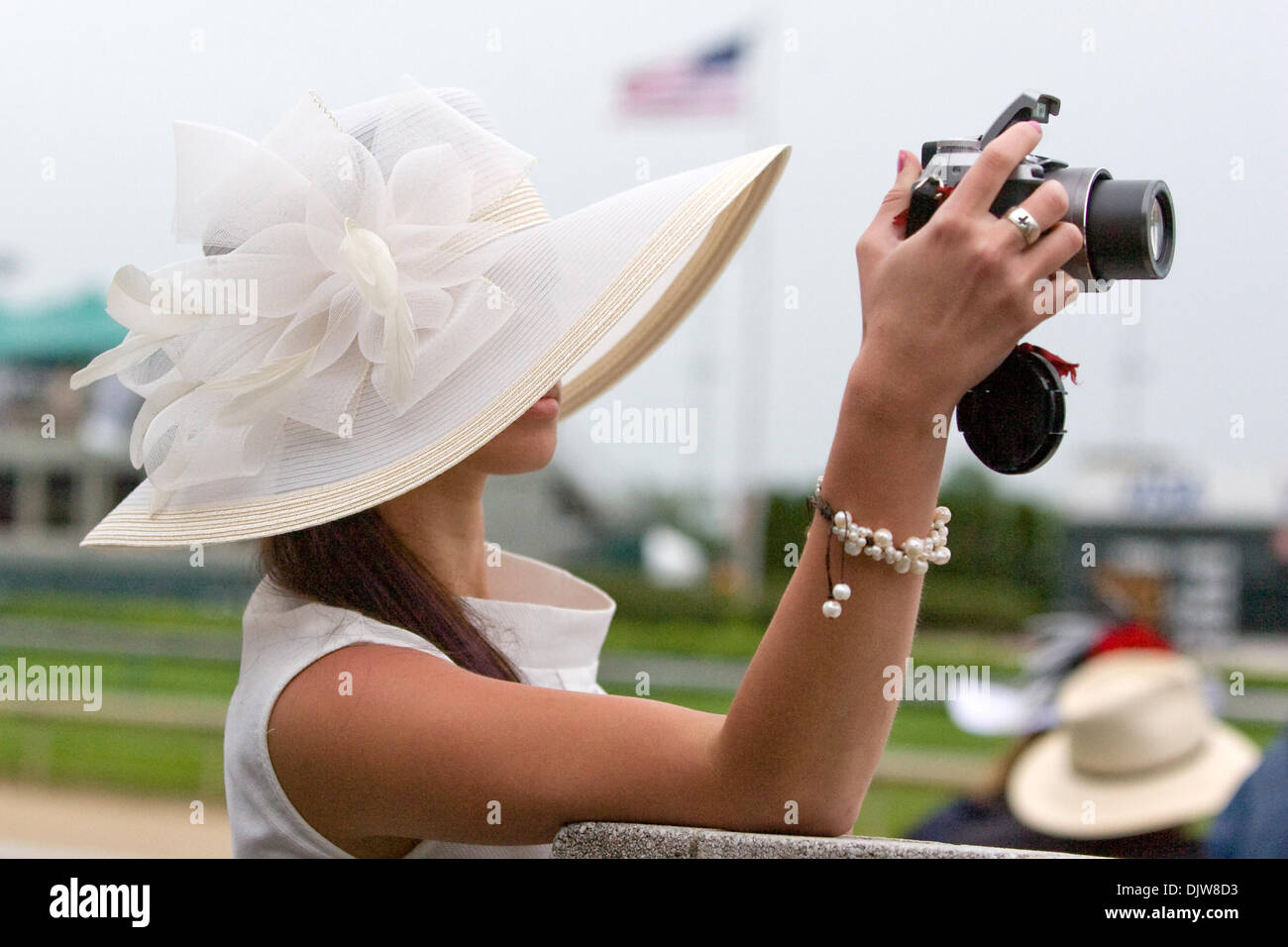 01 May 2010: A lady takes a picture at the rail at the 136th running of the Kentucky Derby.  Jockey Calvin Borel aboard Super Saver (4) crosses the finish line to win the 136th running of the Kentucky Derby before a crowd of 155,084 at Churchill Downs in Louisville, Ky. .Mandatory Credit: Frank Jansky / Southcreek Global (Credit Image: © Frank Jansky/Southcreek Global/ZUMApress.com Stock Photo