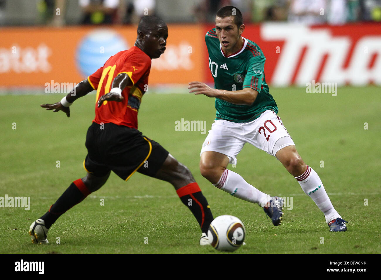 Jorge Torres Nilo (#20) Defender for Mexico passes the ball past Avex (#11) Midfielder for Angola at midfield.  Mexico defeated Angola 1-0 at Reliant Stadium in Houston, TX. (Credit Image: © Anthony Vasser/Southcreek Global/ZUMApress.com) Stock Photo