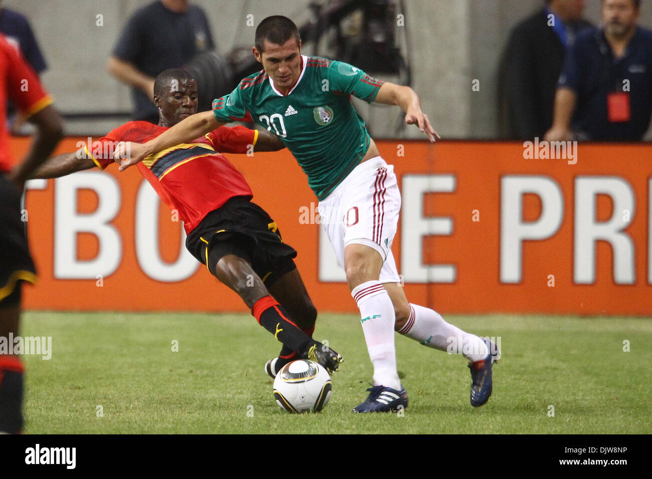Jorge Torres Nilo (#20) Defender for Mexico pushes Gomito (#3) Defender for Angola off the ball deep in Angola territory.  Mexico defeated Angola 1-0 at Reliant Stadium in Houston, TX. (Credit Image: © Anthony Vasser/Southcreek Global/ZUMApress.com) Stock Photo