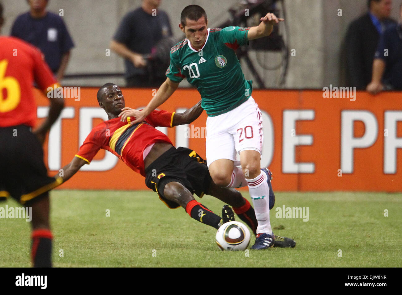 Jorge Torres Nilo (#20) Defender for Mexico pushes Gomito (#3) Defender for Angola off the ball deep in Angola territory.  Mexico defeated Angola 1-0 at Reliant Stadium in Houston, TX. (Credit Image: © Anthony Vasser/Southcreek Global/ZUMApress.com) Stock Photo