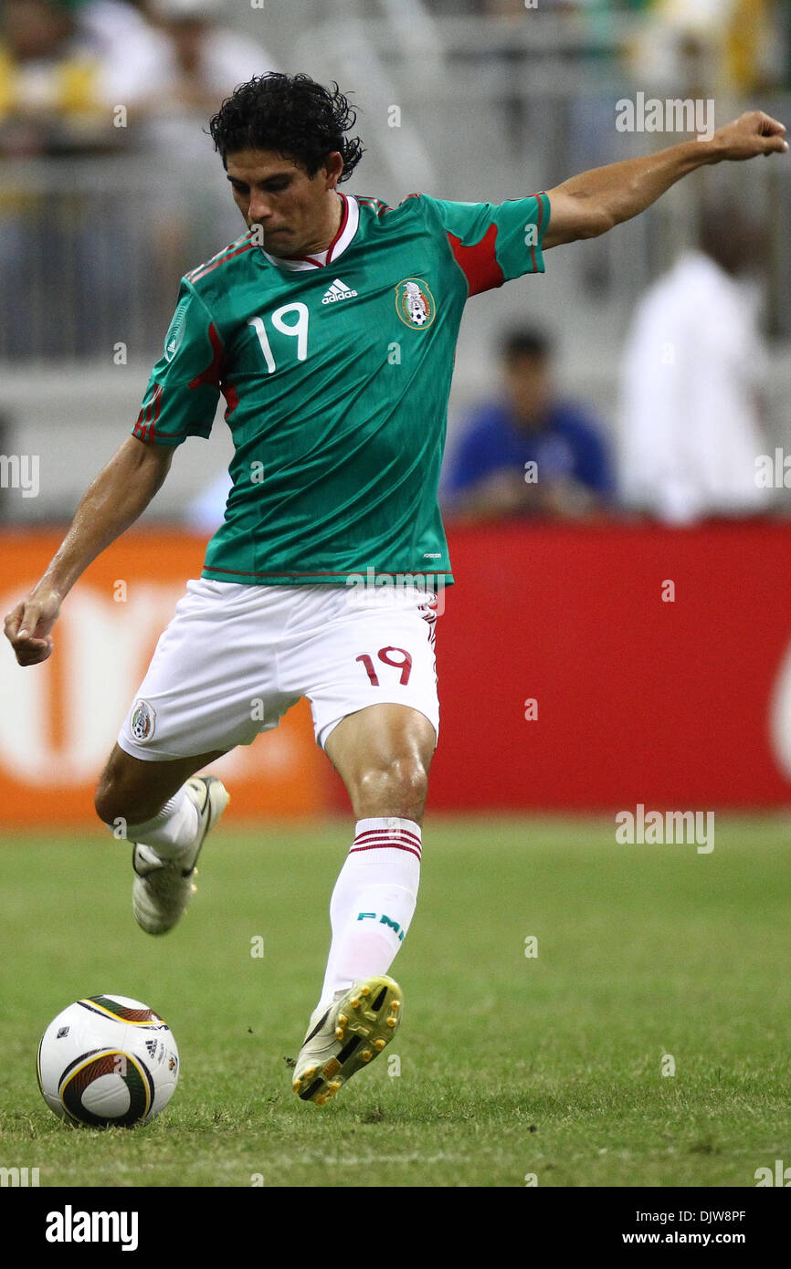 Jonny Magallon (19) Defender for Mexico kicks the ball upfield to an