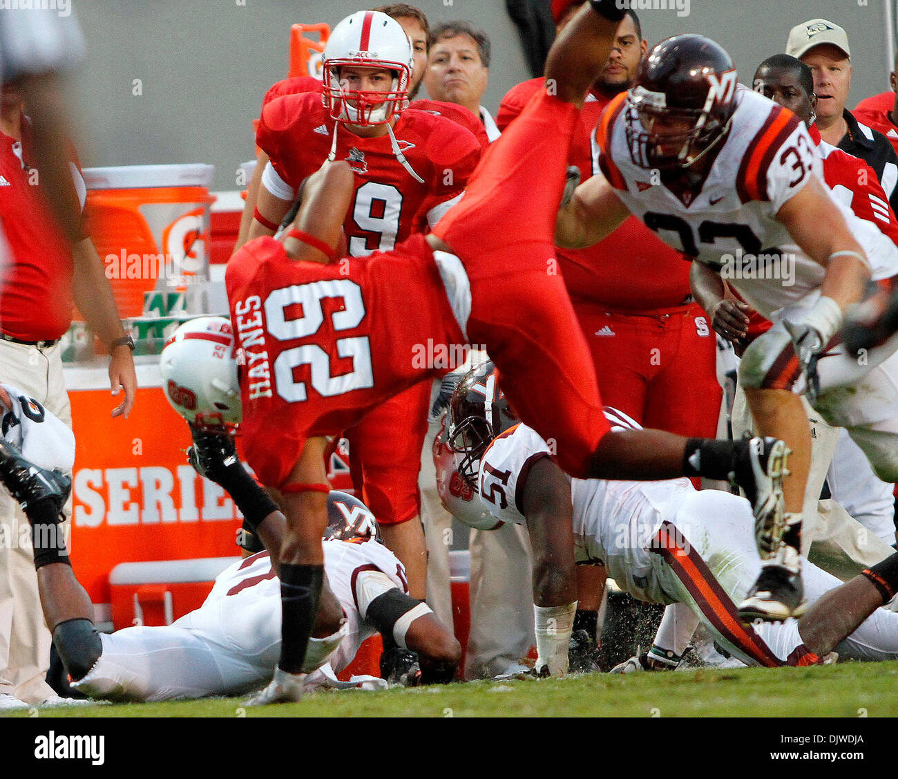 Oct. 2, 2010 - Raleigh, Carter-Finley Stadium, U.S - NC State halfback Dean Haynes (#29) is upended by the Virginia Tech defense as the Hokies defeat NC State leads 41-30 at Carter-Finley stadium in Raleigh, North Carolina. (Credit Image: © Jack Tarr/Southcreek Global/ZUMApress.com) Stock Photo