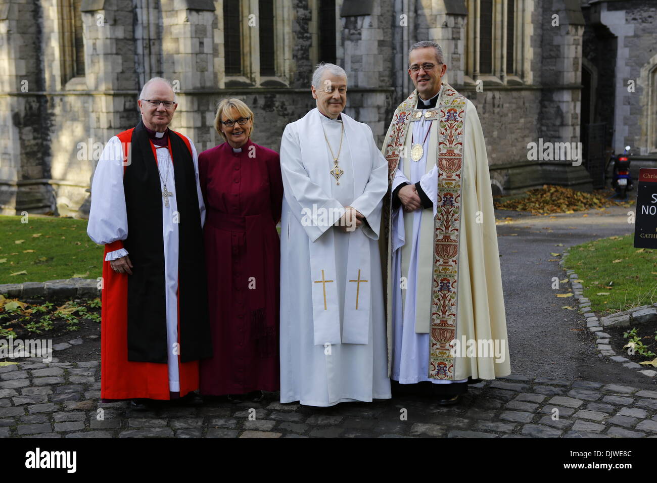 Dublin, Ireland. 30th November 2013. The bishop-elect the Revd Pat Storey (2 L) is pictured with the Archbishop of Armagh, the Most Revd Richard Clarke (L), the Archbishop of Dublin, the Most Revd Dr Michael Jackson (2 R) and The Very Reverend Dermot Dunne (R), the Dean of Christ Church, before the service. The Most Revd Pat Storey has been consecrated as Church of Ireland Bishop of Meath and Kildare in Dublin's Christ Church Cathedral. She is the first female Bishop to be consecrated in any denomination in Ireland and the UK, 23 years after the Church of Ireland approved the ordination of wom Stock Photo