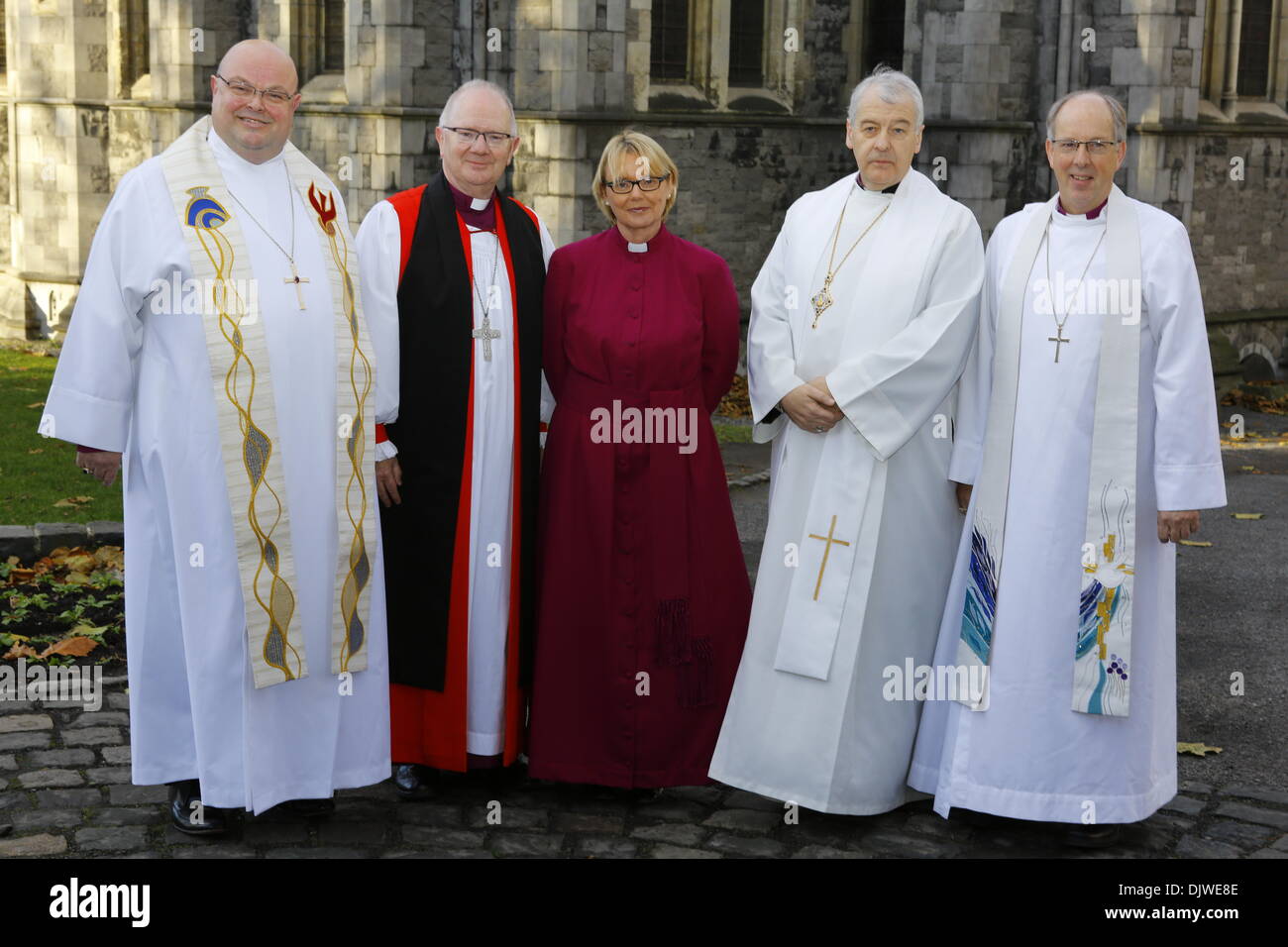 Dublin, Ireland. 30th November 2013. The bishop-elect the Revd Pat Storey (M) is pictured with the Bishop of Cork, Cloyne and Ross, The Right Revd Paul Colton (L), the Archbishop of Armagh, the Most Revd Richard Clarke (2 L), the Archbishop of Dublin, the Most Revd Dr Michael Jackson (2 R) and Bishop of Derry and the Raphoe, The Right Revd Ken Good (R) before the service.  The Most Revd Pat Storey has been consecrated as Church of Ireland Bishop of Meath and Kildare in Dublin's Christ Church Cathedral. She is the first female Bishop to be consecrated in any denomination in Ireland and the UK,  Stock Photo