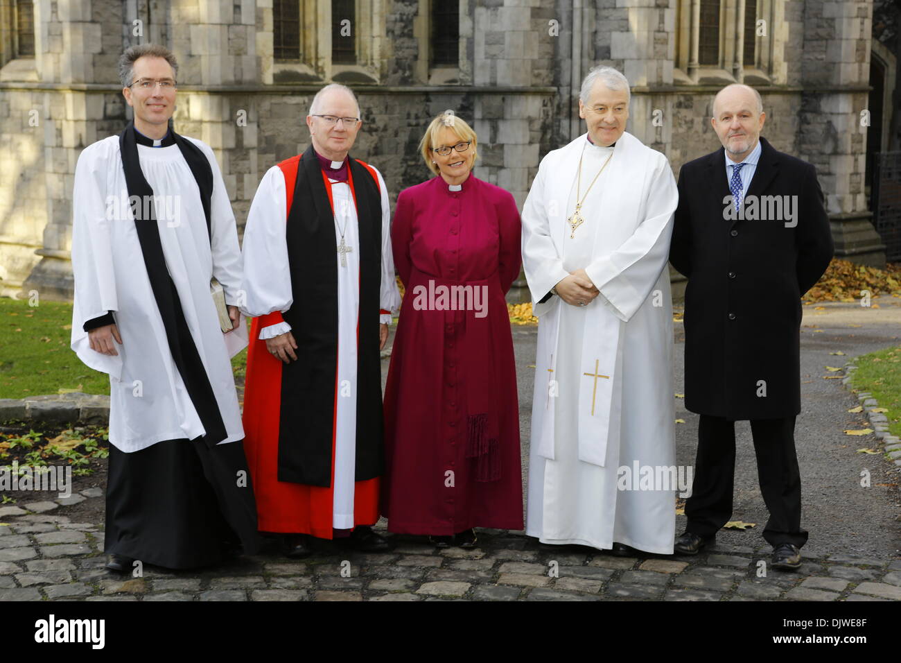 Dublin, Ireland. 30th November 2013. The bishop-elect the Revd Pat Storey (M) is pictured with the Revd Nigel Parker (L), the Archbishop of Armagh, the Most Revd Richard Clarke (2 L), the Archbishop of Dublin, the Most Revd Dr Michael Jackson (2 R) and her husband the Revd Earl Storey (R) before the service. The Most Revd Pat Storey has been consecrated as Church of Ireland Bishop of Meath and Kildare in Dublin's Christ Church Cathedral. She is the first female Bishop to be consecrated in any denomination in Ireland and the UK, 23 years after the Church of Ireland approved the ordination of wo Stock Photo