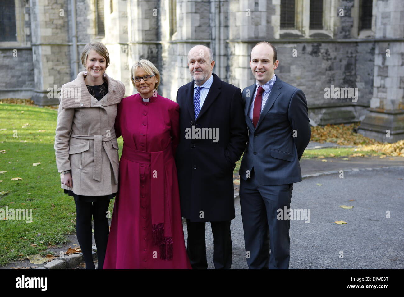 Dublin, Ireland. 30th November 2013. The bishop-elect the Revd Pat Storey (2 L) is pictured with her daughter Carolyn Smith (L), her husband the Revd Earl Storey (2 R)  and her son in law Peter Smith (R) before the service. The Most Revd Pat Storey has been consecrated as Church of Ireland Bishop of Meath and Kildare in Dublin's Christ Church Cathedral. Credit:  Michael Debets/Alamy Live News Stock Photo