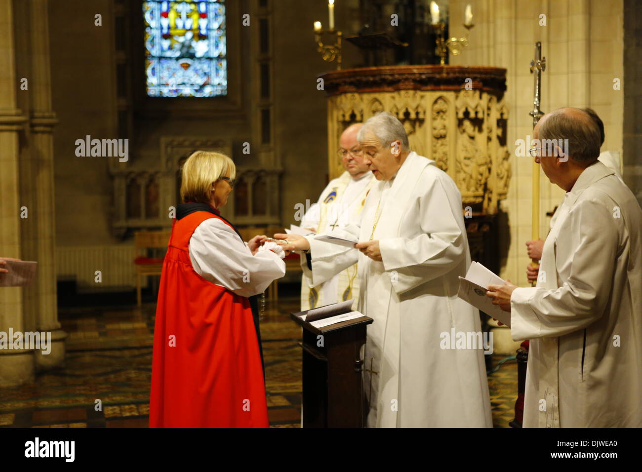Dublin, Ireland. 30th November 2013. The bishop of Meath and Kildare the Most Revd Pat Storey (L) receives her Bishop's Cross from the Archbishop of Dublin, the Most Revd Dr Michael Jackson (R). The Most Revd Pat Storey has been consecrated as Church of Ireland Bishop of Meath and Kildare in Dublin's Christ Church Cathedral. Credit:  Michael Debets/Alamy Live News Stock Photo