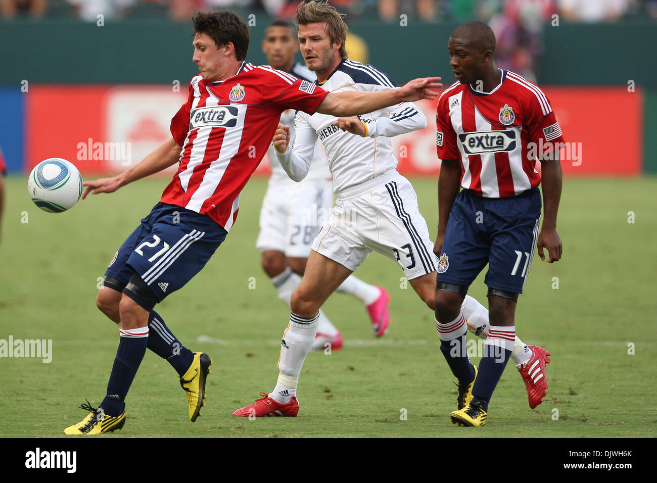 Oct. 3, 2010 - Carson, California, United States of America - Chivas USA midfielder Ben Zemanski #21 (L) controls the ball while holding off Los Angeles Galaxy midfielder David Beckham #23 (mid) and with support from Chivas USA midfielder Michael Lahoud #11 (R) during the Chivas USA vs Los Angeles Galaxy game at the Home Depot Center. The Galaxy went on to defeat Club Depotivo Chiv Stock Photo