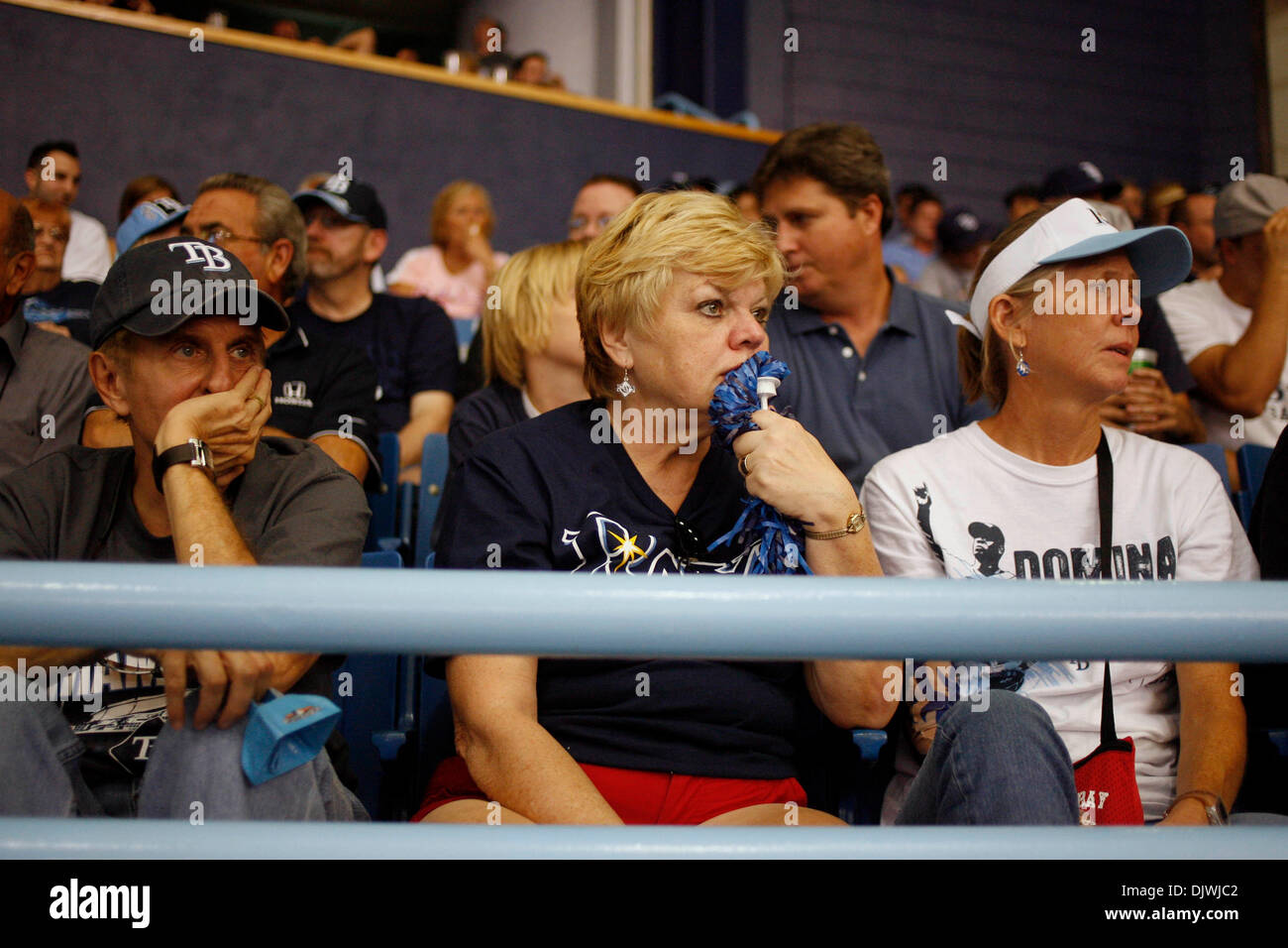 Oct. 7, 2010 - St. Petersburg - CHRIS ZUPPA   |   Times.SP 329225 ZUPP Rays 12.(St. Petersburg, 10/07/2010) (left to right) Tampa Bay Rays fans Frank Casorio of St. Pete Beach, his wife, Dianne Casorio of St. Pete Beach and her friend, Debbie Haynes of Gulfport react to the end of the sixth inning. Tampa Bay Rays play the Texas Rangers for game two of the ALDS at Tropicana Field. [ Stock Photo