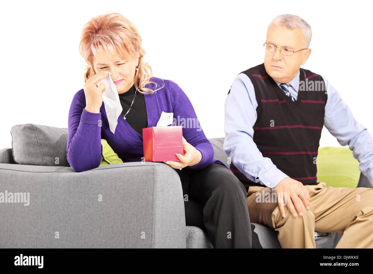 Woman wiping his eyes from crying after quarrel with her husband Stock Photo