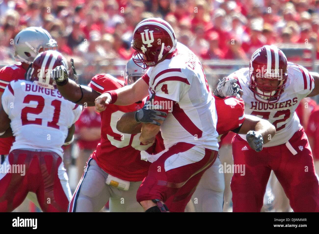 Oct. 9, 2010 - Columbus, Ohio, United States of America - Indiana QB Ben Chappell (4) is pressured by Ohio State DE Solomon Thomas (98) and Cameron Heyward (97) in the second quarter of the game between Indiana and Ohio State at Ohio Stadium, Columbus, Ohio. Ohio State defeated Indiana 38-10. (Credit Image: © Scott Stuart/Southcreek Global/ZUMApress.com) Stock Photo