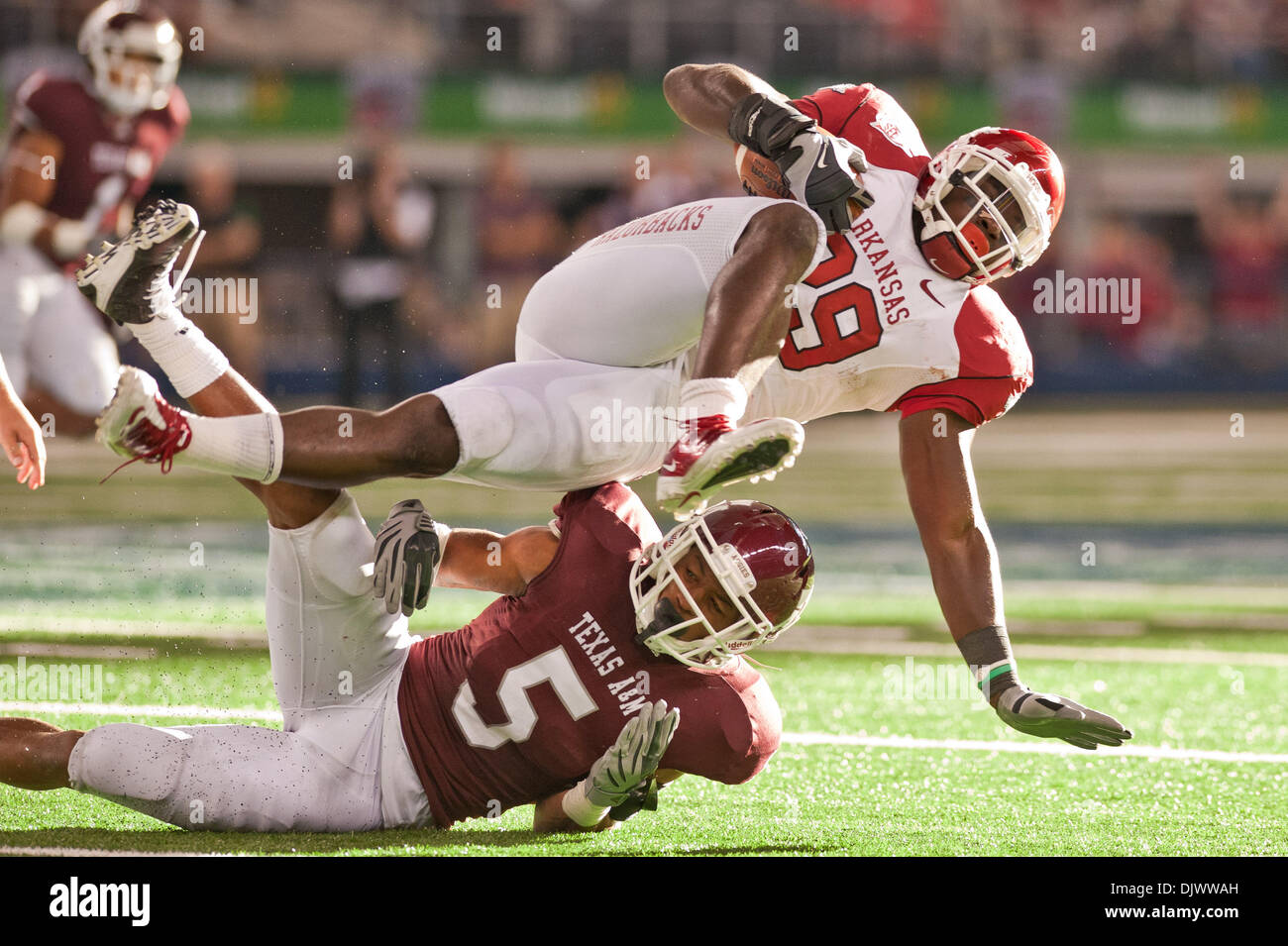 Oct. 11, 2010 - Arlington, Texas, United States of America - Arkansas Razorbacks running back Broderick Green (29) stretches for a first down over Texas A&M Aggies cornerback Coryell Judie (5)during the game between the University of Arkansas and Texas A&M. The Razorbacks defeated the Aggies 24-17 at Cowboys Stadium in Arlington, Texas. (Credit Image: © Jerome Miron/Southcreek Glob Stock Photo