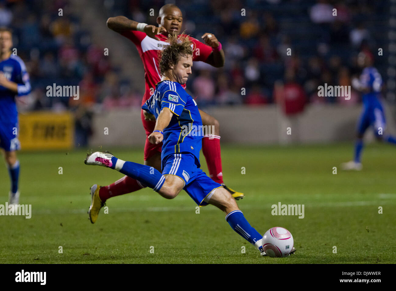 Oct. 12, 2010 - Bridgeview, Illinois, United States of America - Kansas City Wizards defender Michael Harrington (2) plays the ball down field as Chicago Fire forward Collins John (15) defends during the MLS game between the Chicago Fire and the Kansas City Wizards at Toyota Park in Bridgeview, IL. The Wizards defeated the Fire 2-0. (Credit Image: © Geoffrey Siehr/Southcreek Global Stock Photo