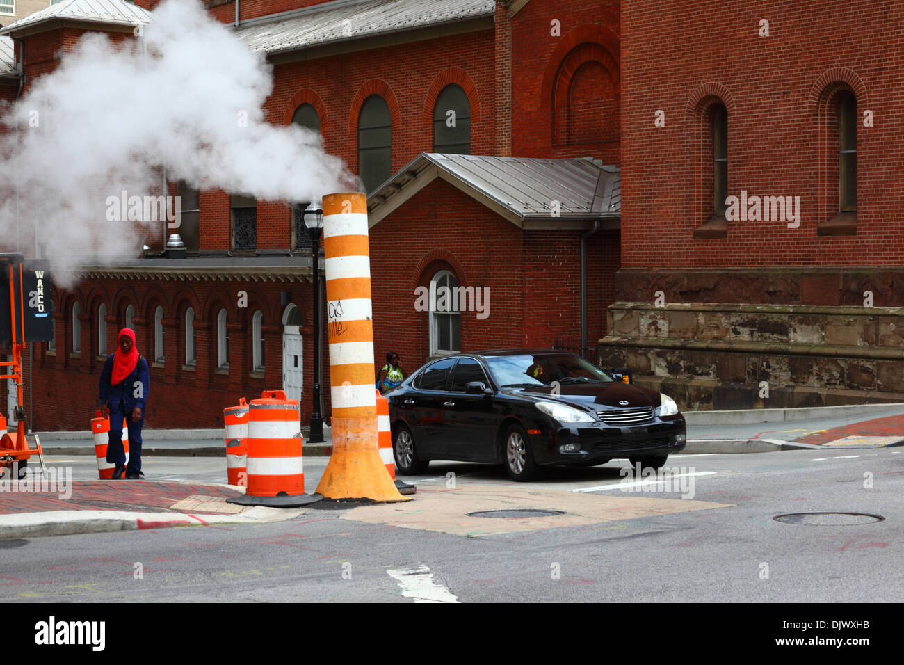 Steam vapor being vented from underground heating / cooling system through a chimney, Baltimore, Maryland, USA Stock Photo