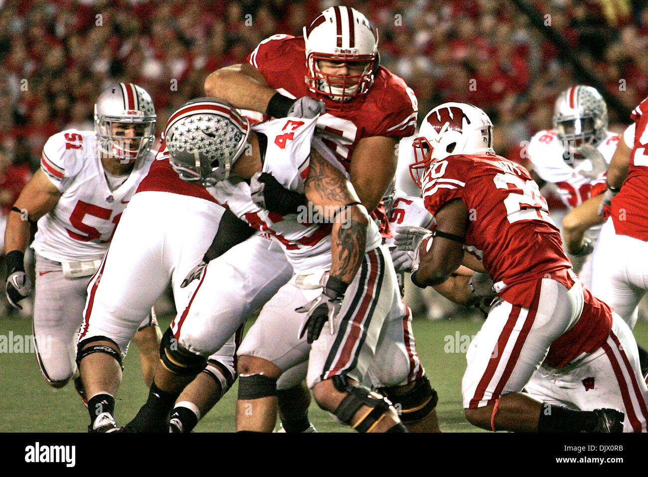 Oct. 16, 2010 - Madison, Wisconsin, United States of America - Wisconsin RB James White (20) runs behind the block of OT Gabe Carimi (68) in the first quarter of the game between #1 Ohio State and #18 Wisconsin at Camp Randall Stadium, Madison, Wisconsin. Wisconsin defeated Ohio State 31-18. (Credit Image: © Scott Stuart/Southcreek Global/ZUMApress.com) Stock Photo