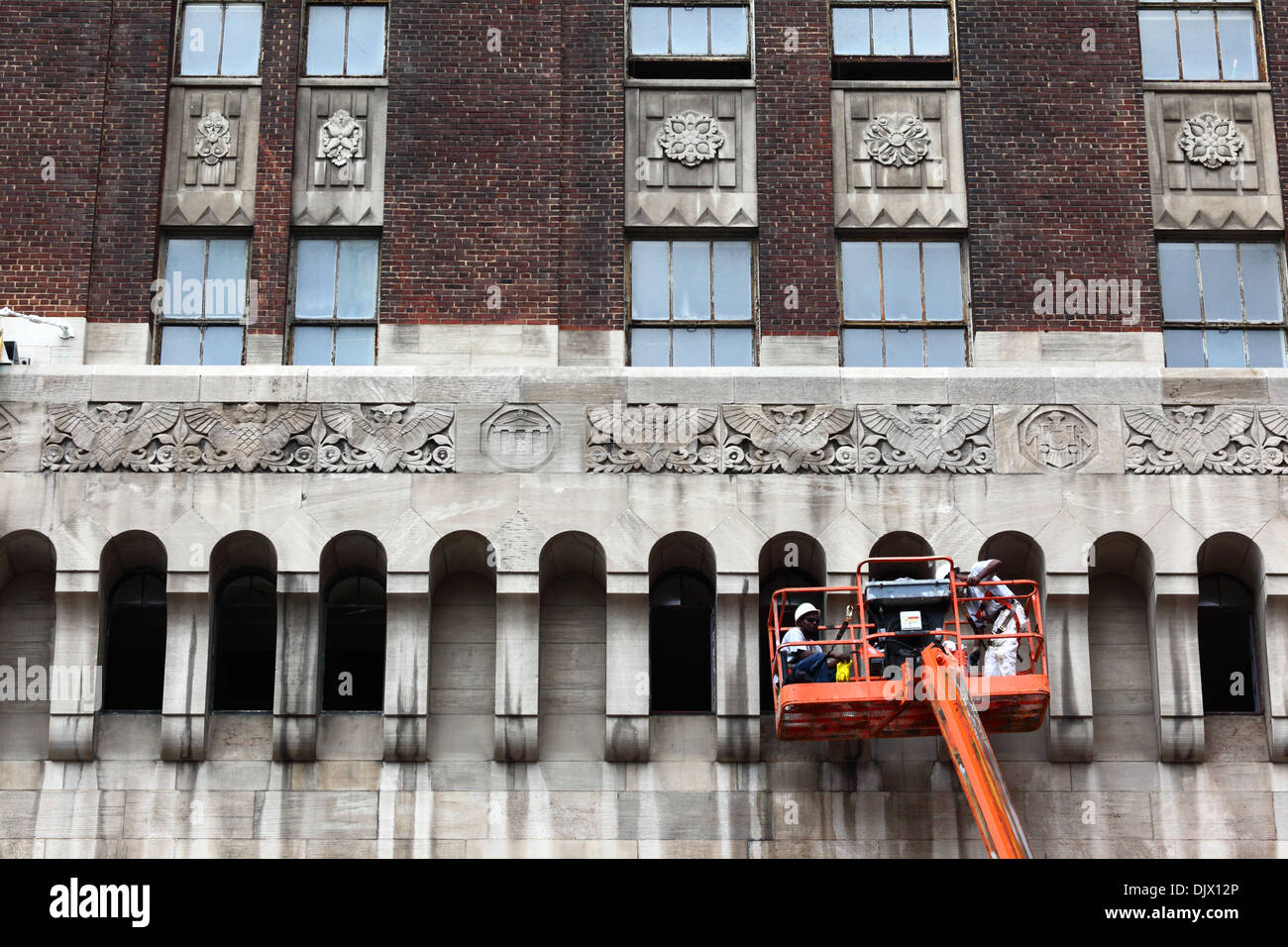 Workers cleaning part of the Bank of America Building, Baltimore City