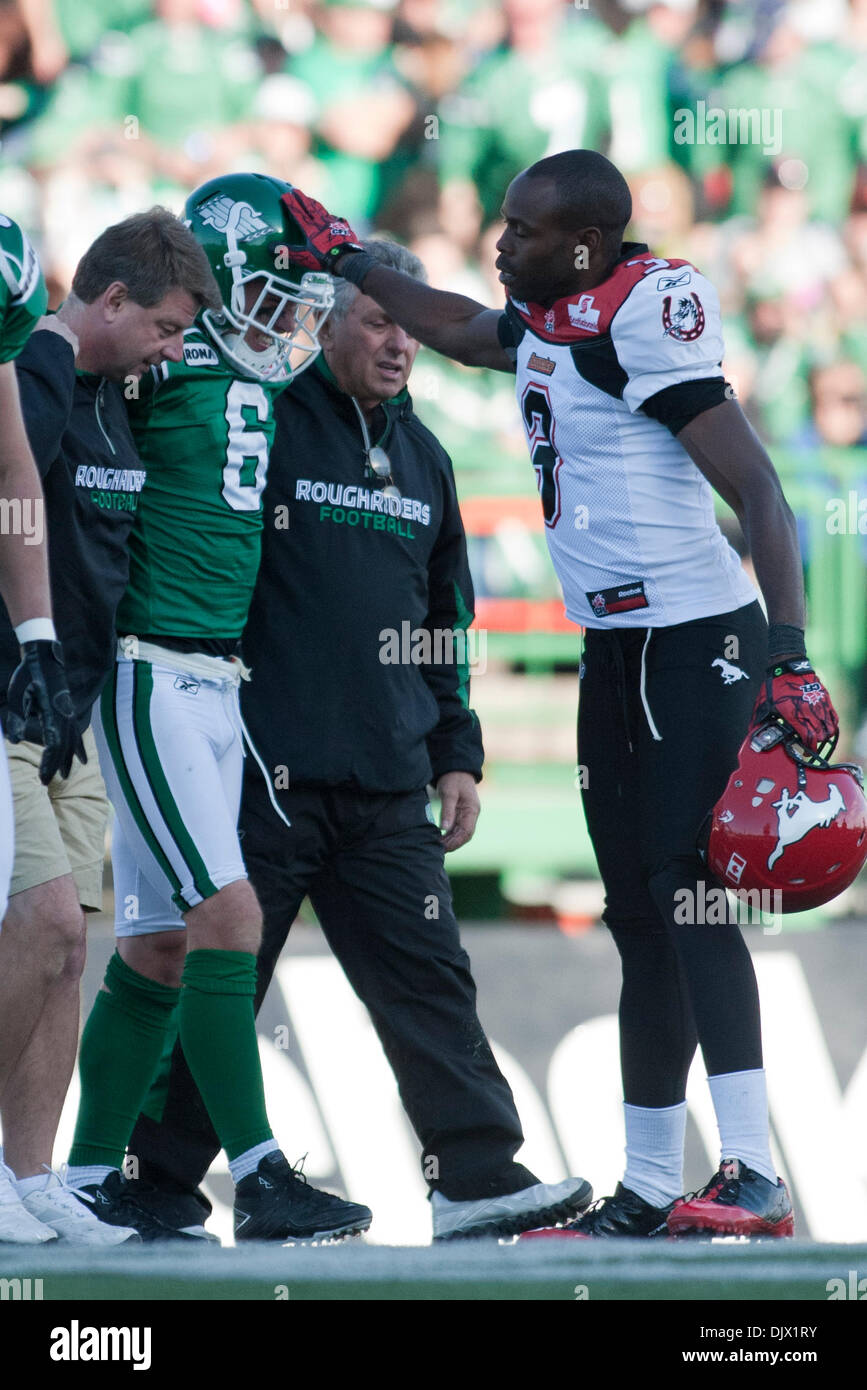 Oct 17 2010 Regina Saskatchewan Canada Calgary Stampeders Wide Receiver Ryan Thelwell 3 Taps The Injured Saskatchewan Roughriders Wide Receiver Rob Bagg 6 On The Helmet As He Leave The