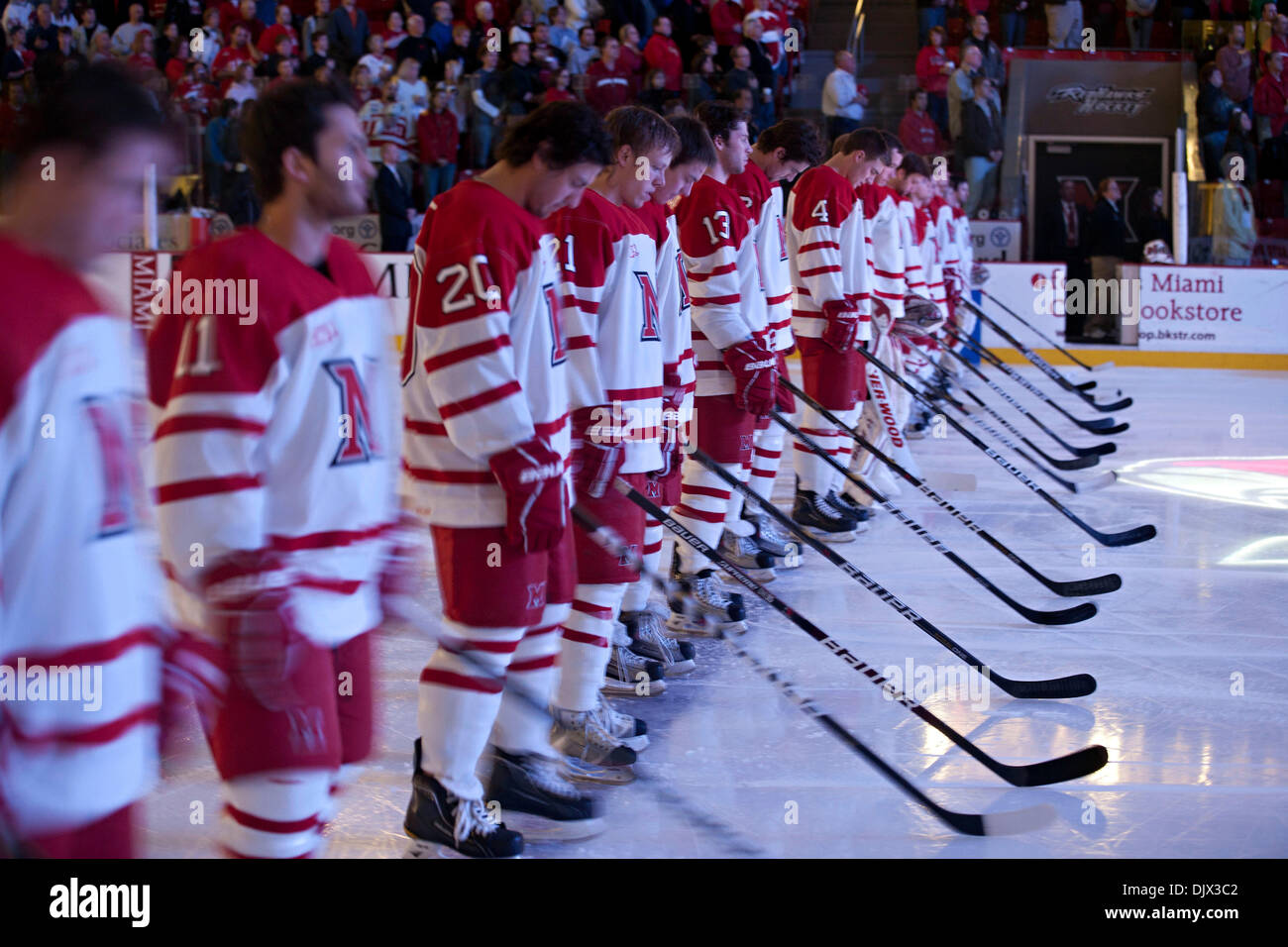 Oct. 23, 2010 - Oxford, Ohio, United States of America - The Miami (OH) University's Hockey Team line up during the National Anthem before the first period of play against Northern Michigan University at Miami University's Steve Cady Arena at the Goggin Ice Center in Oxford, Ohio Saturday evening October 23, 2010. The Miami University Redhawks beat the Northern Michigan University  Stock Photo