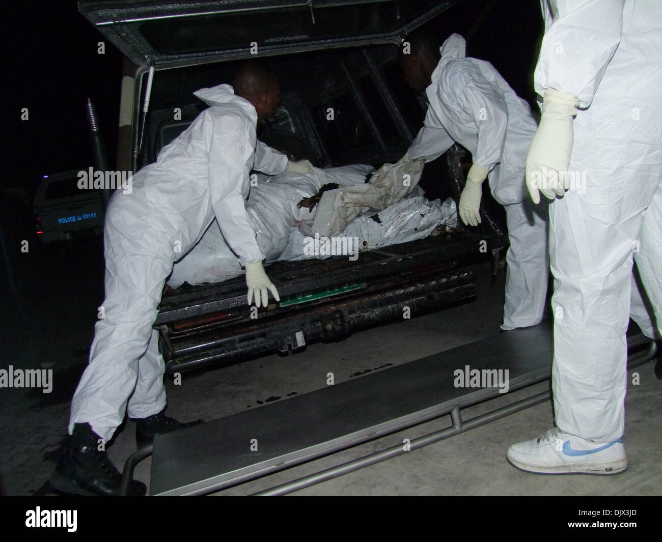 Windhoek, Namibia. 1st Dec, 2013. Rescuers load bodies of victims onto