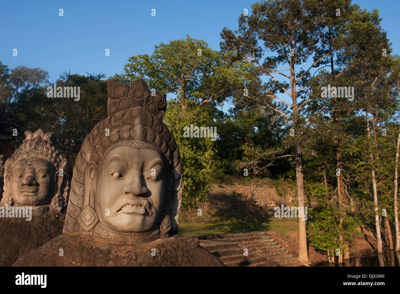 Stone warrior heads at Angkor Thom, Cambodia. Stock Photo