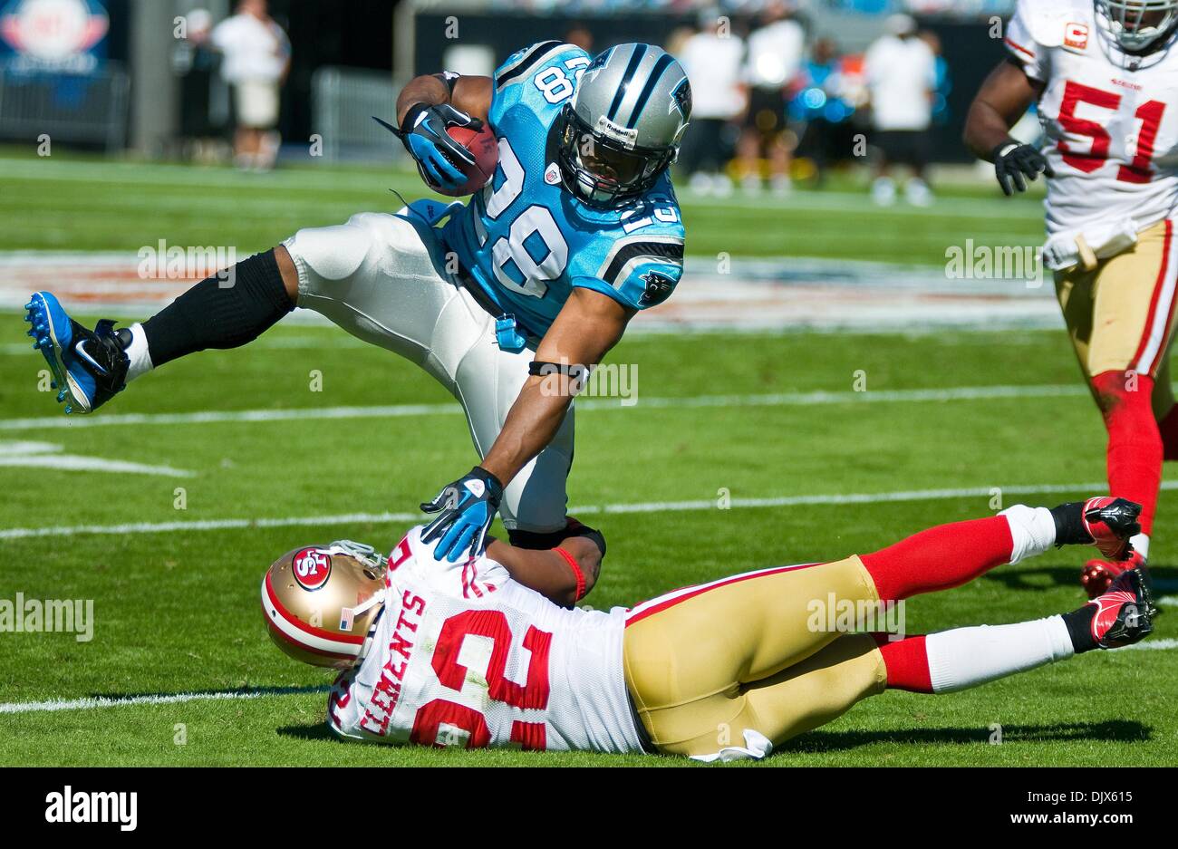 Oct. 24, 2010 - Charlotte, North Carolina, United States of America - Carolina Panthers running back Jonathan Stewart (28) jumps over San Francisco 49ers cornerback Nate Clements (22).The Panthers and 49er's are tied 10-10 at the half at Bank of America Stadium, Charlotte NC. (Credit Image: © Mark Abbott/Southcreek Global/ZUMApress.com) Stock Photo