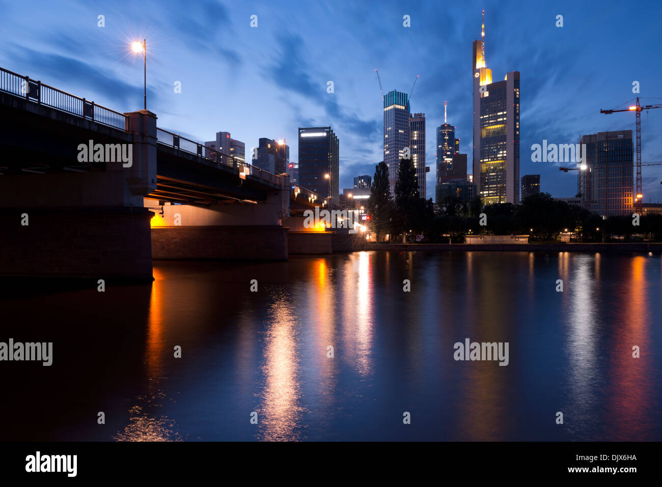 Skyscrapers illuminated at night in the financial centre of Frankfurt ...