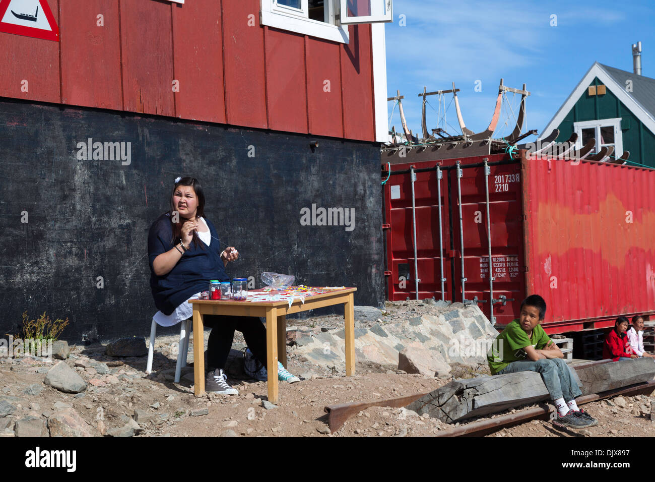 Local woman demonstrating the art of beading, Ittoqqortoormiit, Greenland Stock Photo