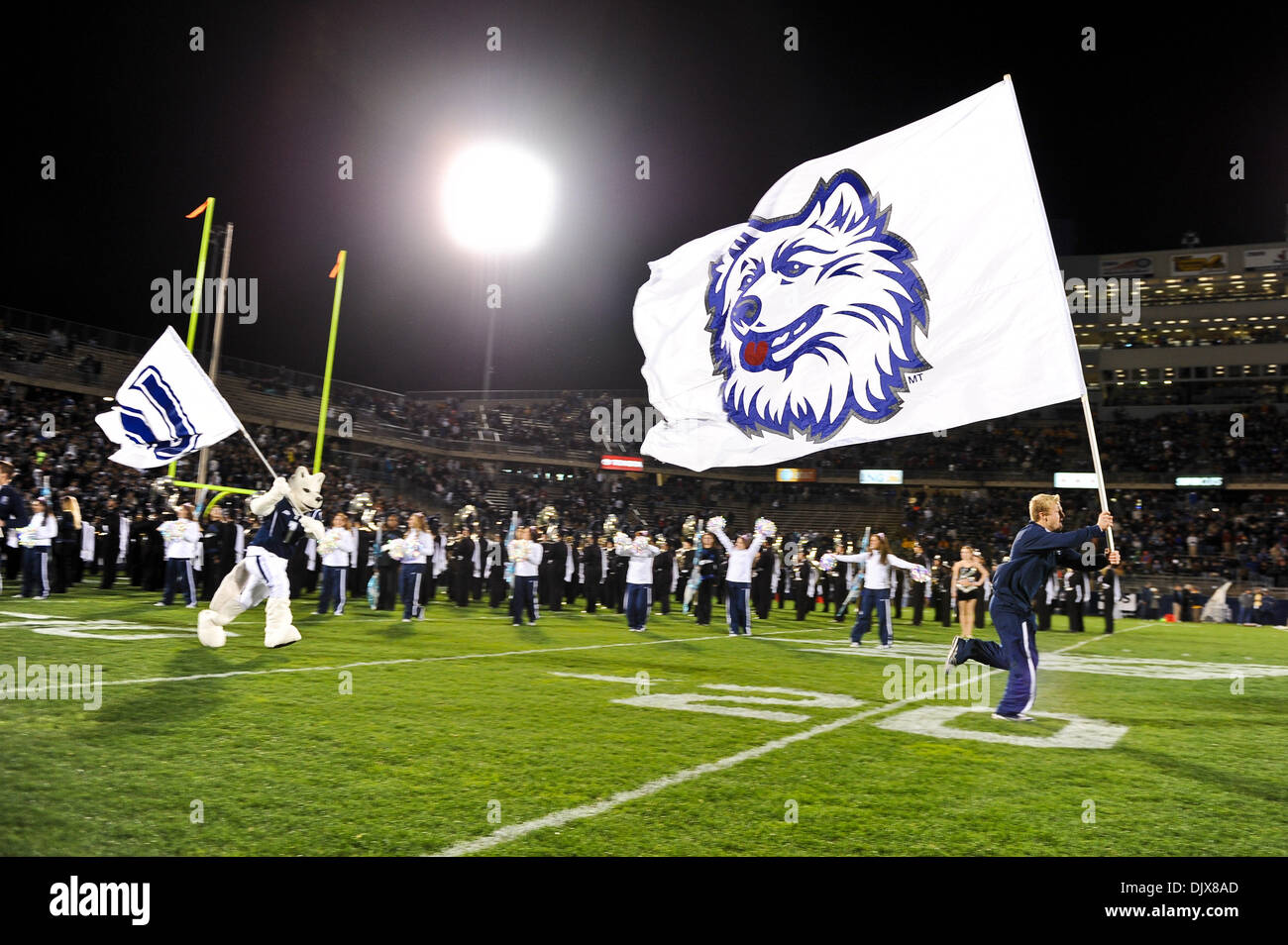 Oct. 29, 2010 - East Hartford, Connecticut, United States of America - The UConn Cheerleaders lead the football team onto the field. At the half West Virginia leads UConn 10-3 at Rentschler Field. (Credit Image: © Geoff Bolte/Southcreek Global/ZUMApress.com) Stock Photo