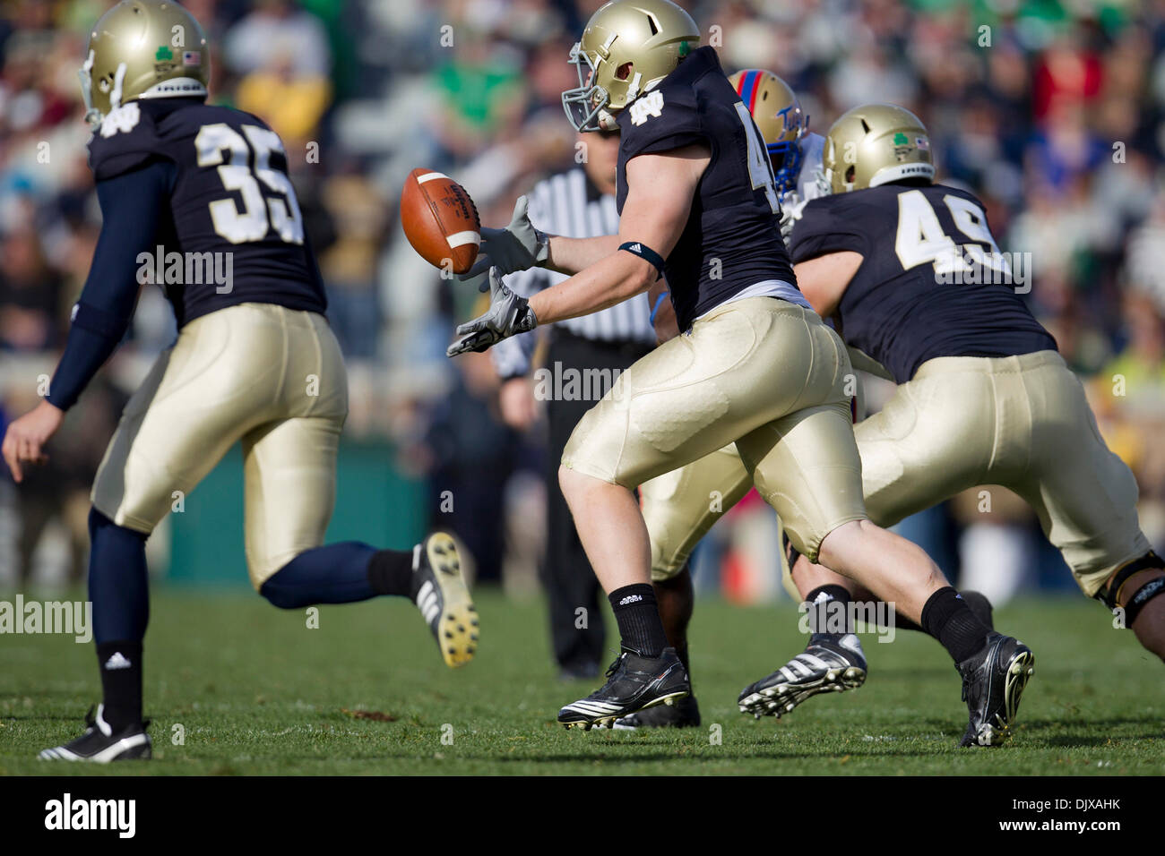 Oct. 30, 2010 - South Bend, Indiana, United States of America - Notre Dame tight end/fullback Bobby Burger (#41) grabs ball of fake punt during NCAA football game between Tulsa and Notre Dame.  The Tulsa Golden Hurricane defeated the Notre Dame Fighting Irish 28-27 in game at Notre Dame Stadium in South Bend, Indiana. (Credit Image: © John Mersits/Southcreek Global/ZUMApress.com) Stock Photo