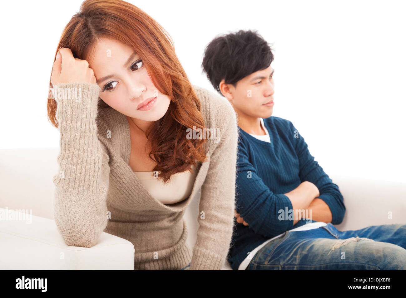 young Couple sitting on the sofa during conflict Stock Photo - Alamy