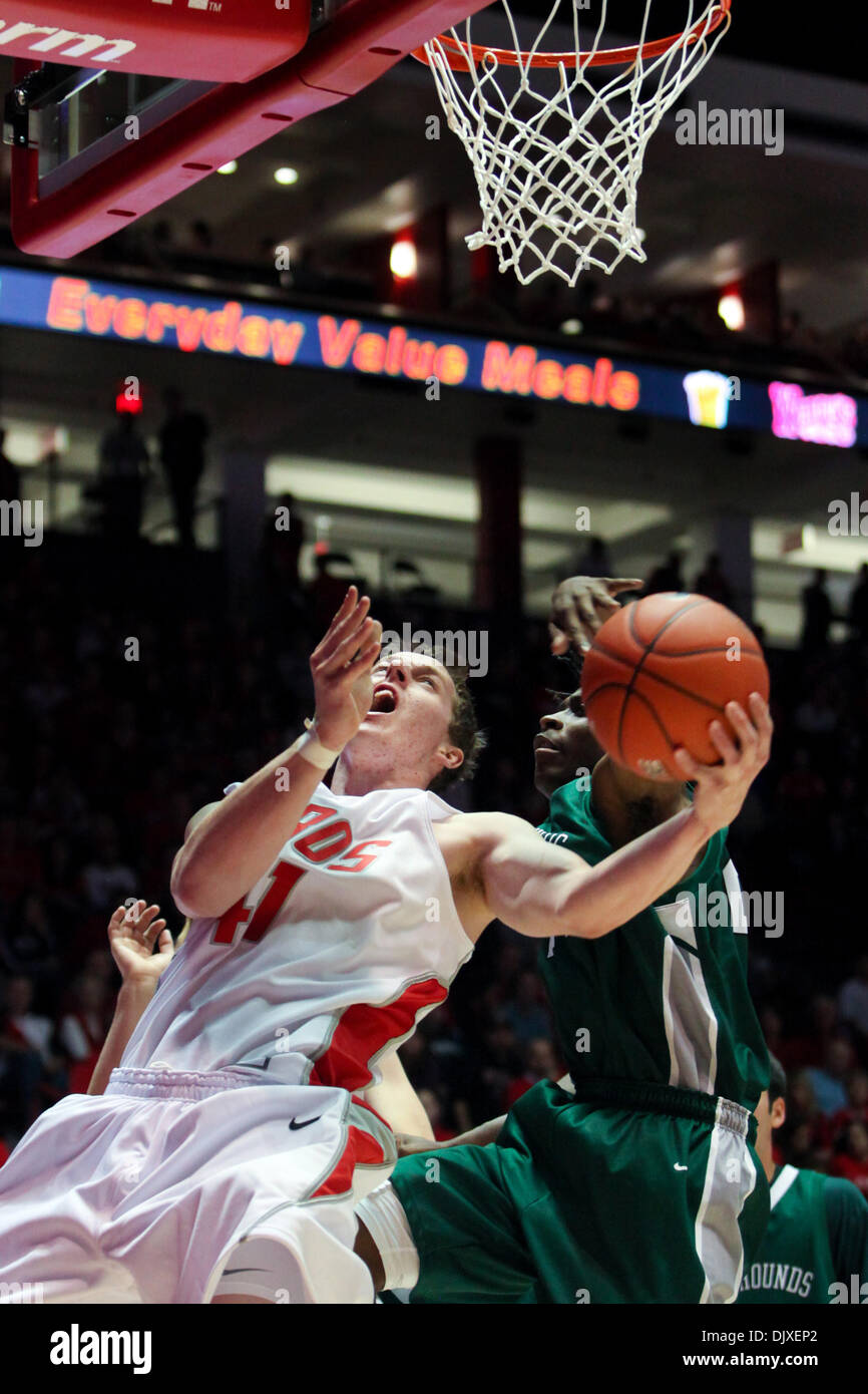 Nov. 3, 2010 - Albuquerque, New Mexico, United States of America - New  Mexico forward Cameron Bairstow (#41) trying to put the ball up for two  points while an Eastern New Mexico