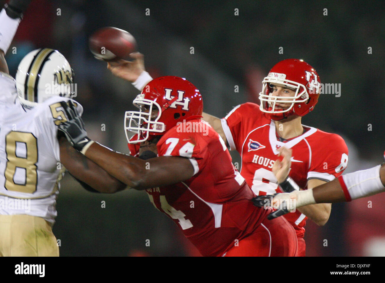 Nov. 5, 2010 - Houston, Texas, United States of America - University of Houston quarterback David Piland (8) back in the pocket to throw a pass. The University of Central Florida Knights defeated The University of Houston Cougars 40 - 33 at Robertson Stadium in Houston, Texas. (Credit Image: © Luis Leyva/Southcreek Global/ZUMApress.com) Stock Photo