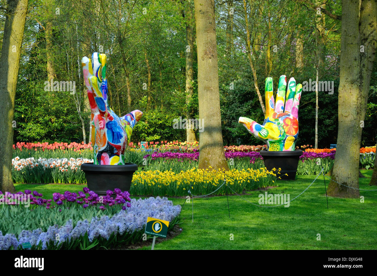 Groene Vingers (Big colorful hands) with tulips in Keukenhof park in ...