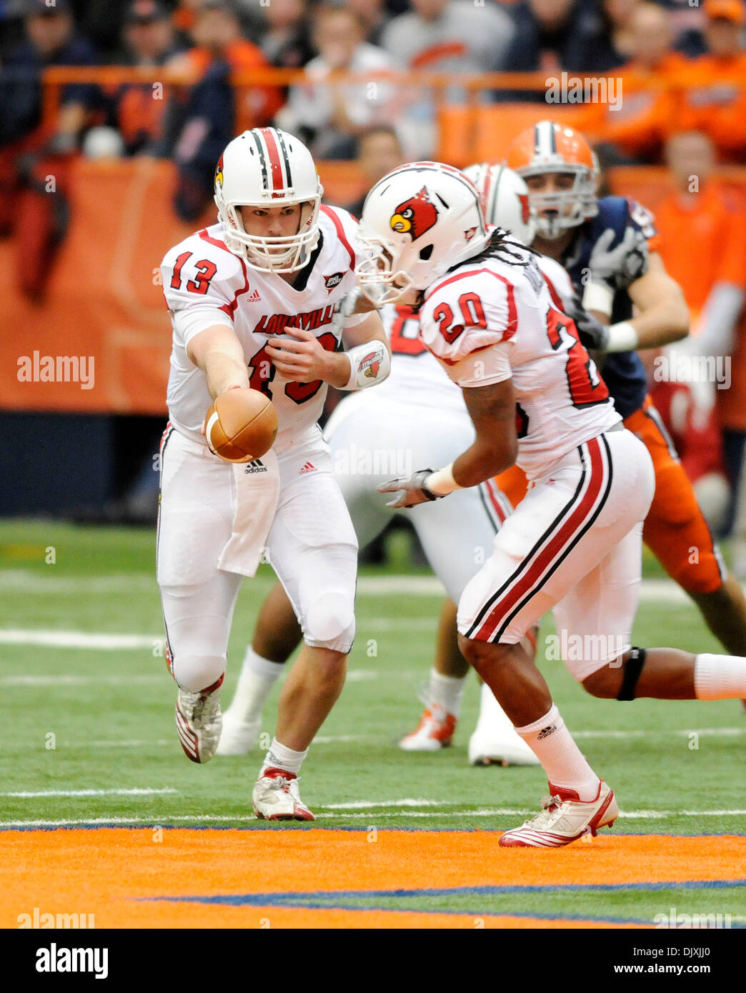 November 6, 2010: Louisville defeated Syracuse 28-20 at the Carrier Dome in Syracuse, NY. Louisville quarterback Justin Burke (13) hands the football off to Louisville running back Victor Anderson (20) while playing Syracuse.(Credit Image: © Alan Schwartz/Cal Sport Media/ZUMApress.com) Stock Photo