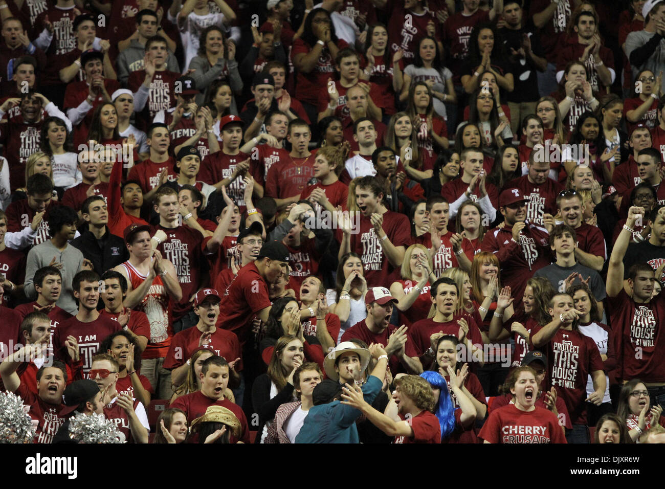 Nov. 12, 2010 - Philadelphia, Pennsylvania, United States of America - Temple fans dressed in a sea of red cheer in a game where Temple defeated Seton Hall 62 to 56. (Credit Image: © Bill Streicher/Southcreek Global/ZUMApress.com) Stock Photo