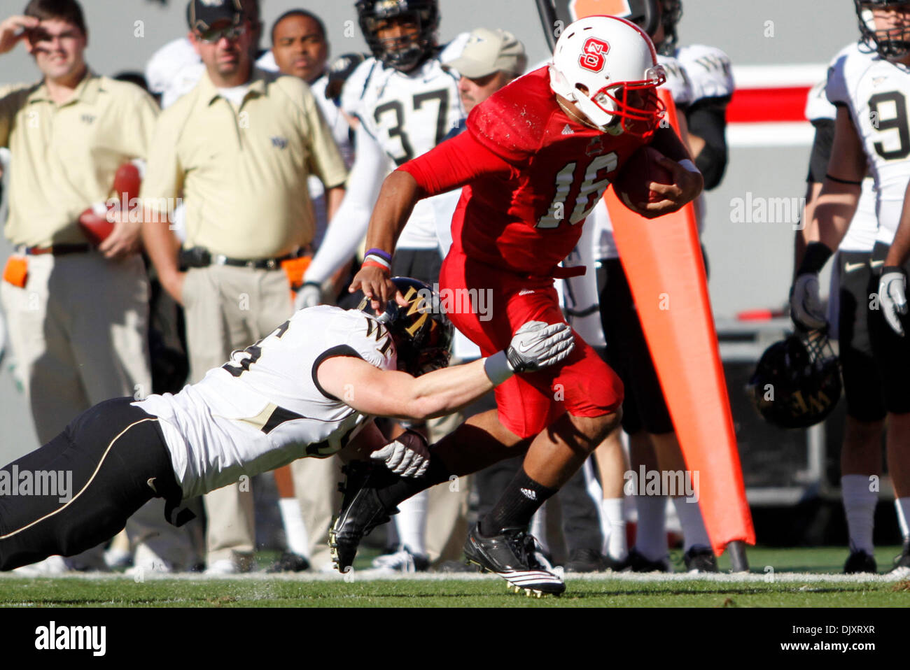 Sept. 16, 2010 - Raleigh, North Carolina, United States of America - NC  State quarterback Russell Wilson (#16) hands the ball off at Carter-Finley  Stadium in Raleigh, North Carolina (Credit Image: ©