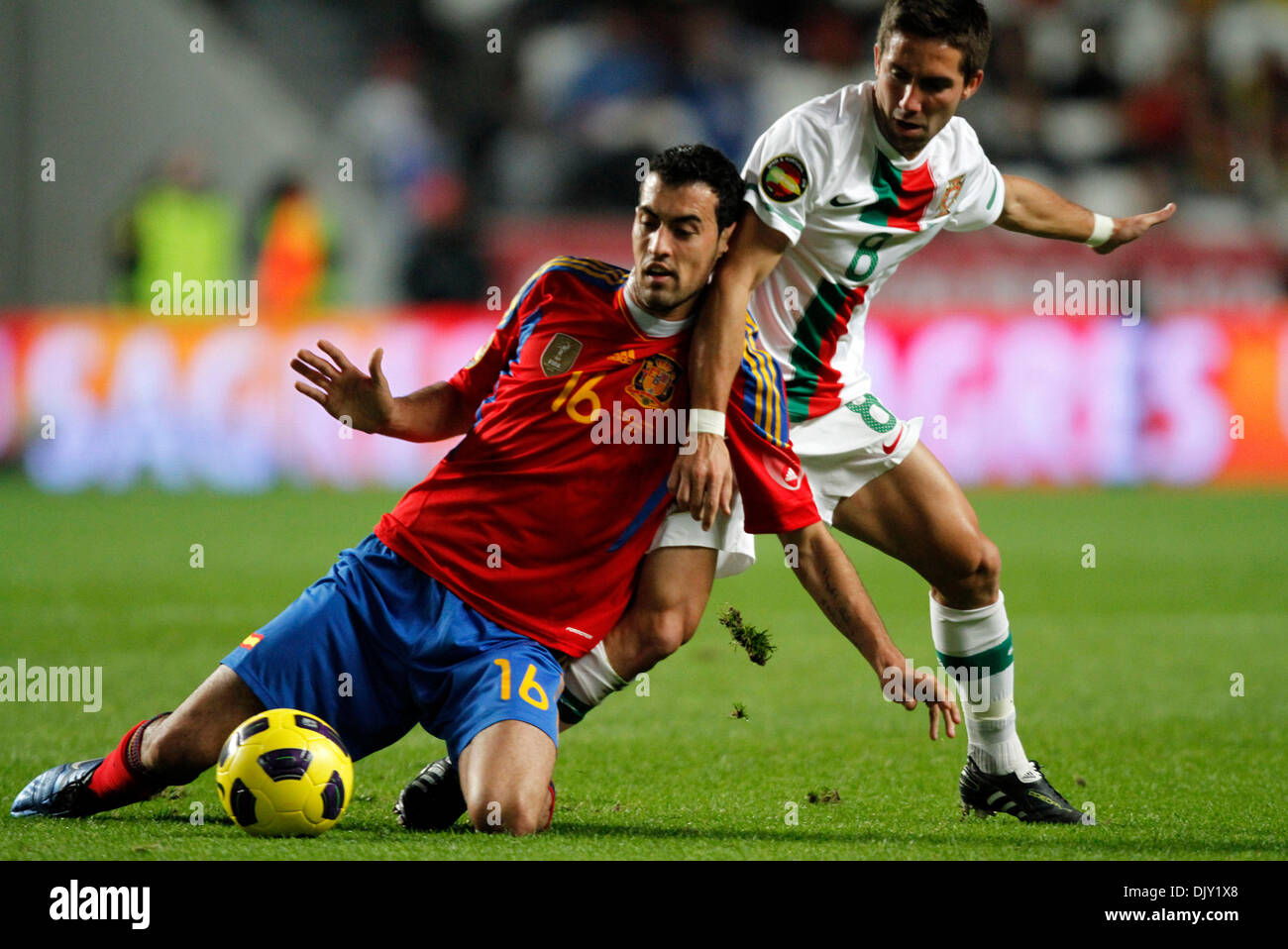 Nov 17, 2010 - Lisbon, Portugal - Portuguese JOAO MOUTINHO (R) vies with Spanish SERGIO BUSQUETS (L) during their soccer match to promote the candidacy of the two countries to the World Cup for 2018 and 2022 at Luz Stadium in Lisbon. (Credit Image: © Paul Cordeiro/ZUMApress.com) Stock Photo