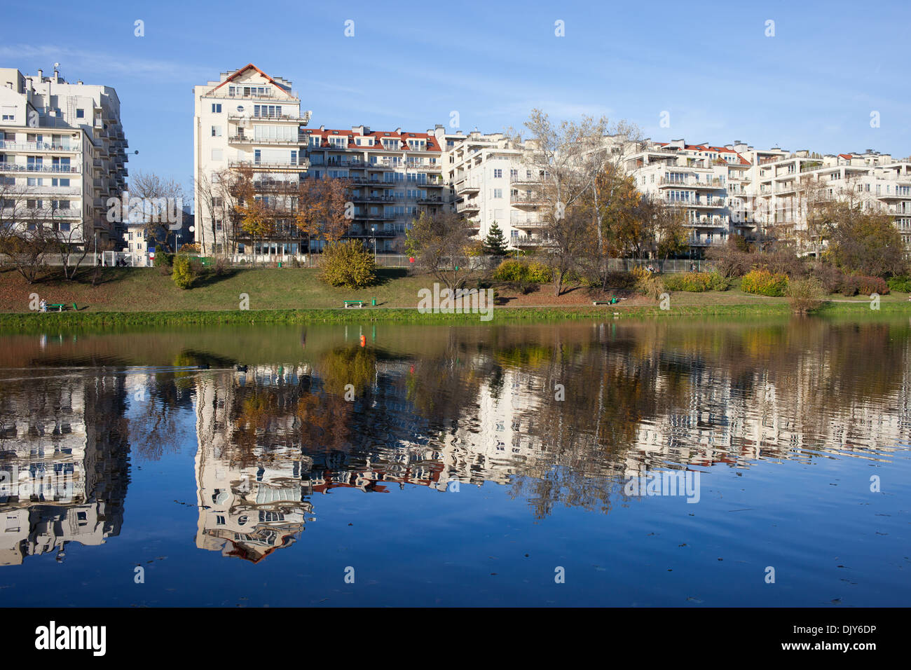 Apartment houses condominium complex along the lake in Skaryszewski Park in Warsaw, Poland. Stock Photo