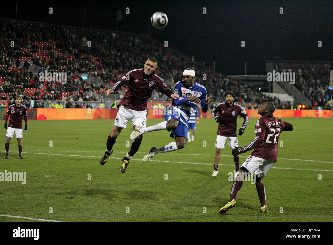 Nov. 21, 2010 - Toronto, Ontario, Canada - Colorado Rapids Defender L (#3) Drew Moore goes for the header against FC Dallas Midfielder R (#18) Marvin Chavez  late in extra-time. The game was played at BMO Field in Toronto, Ontario. The Colorado Rapids defeated FC Dallas 2-1 in extra-time to win the MLS Cup. (Credit Image: © Steve Dormer/Southcreek Global/ZUMAPRESS.com) Stock Photo