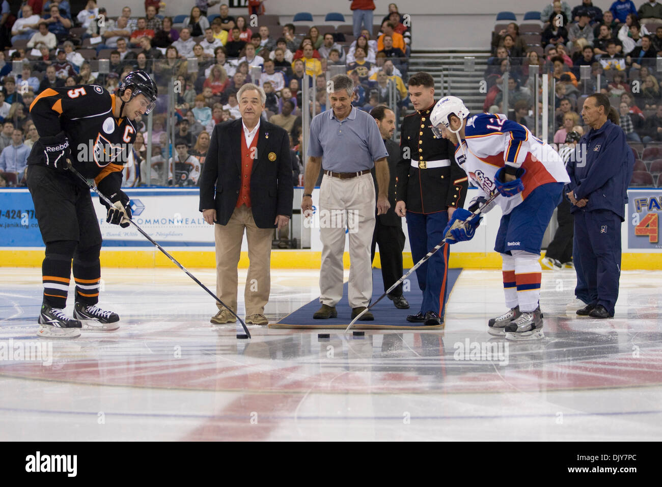 Nov. 21, 2010 - Norfolk, Virginia, United States of America -  Norfolk Admirals Paul Szczechura (12) and Adirondack Phantom Dan Jancevski(5) participant in the ceremony puck drop with members of the Marine Corps during the per-game celebration. Norfolk defeated Adirondack 3-1 at Norfolk Scope, Norfolk Virginia. (Credit Image: © Charles Barner/Southcreek Global/ZUMAPRESS.com) Stock Photo