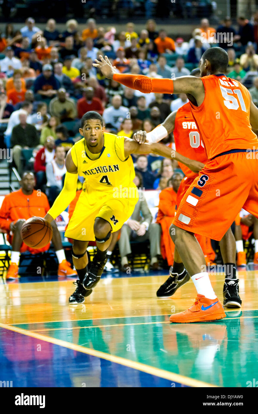 Nov. 26, 2010 - Atlantic City, New Jersey, United States of America - Nov 26, 2010 - Atlantic City, New Jersey, United States of America -   Michigan's Darius Morris #4, drives to the basket against Syracuse's Fabricio Melo #52 during the first half of their game at the Legend's Classic at the Boardwalk Hall.  Michigan led at halftime 31-29. (Credit Image: © Bill Guerro/Southcreek  Stock Photo