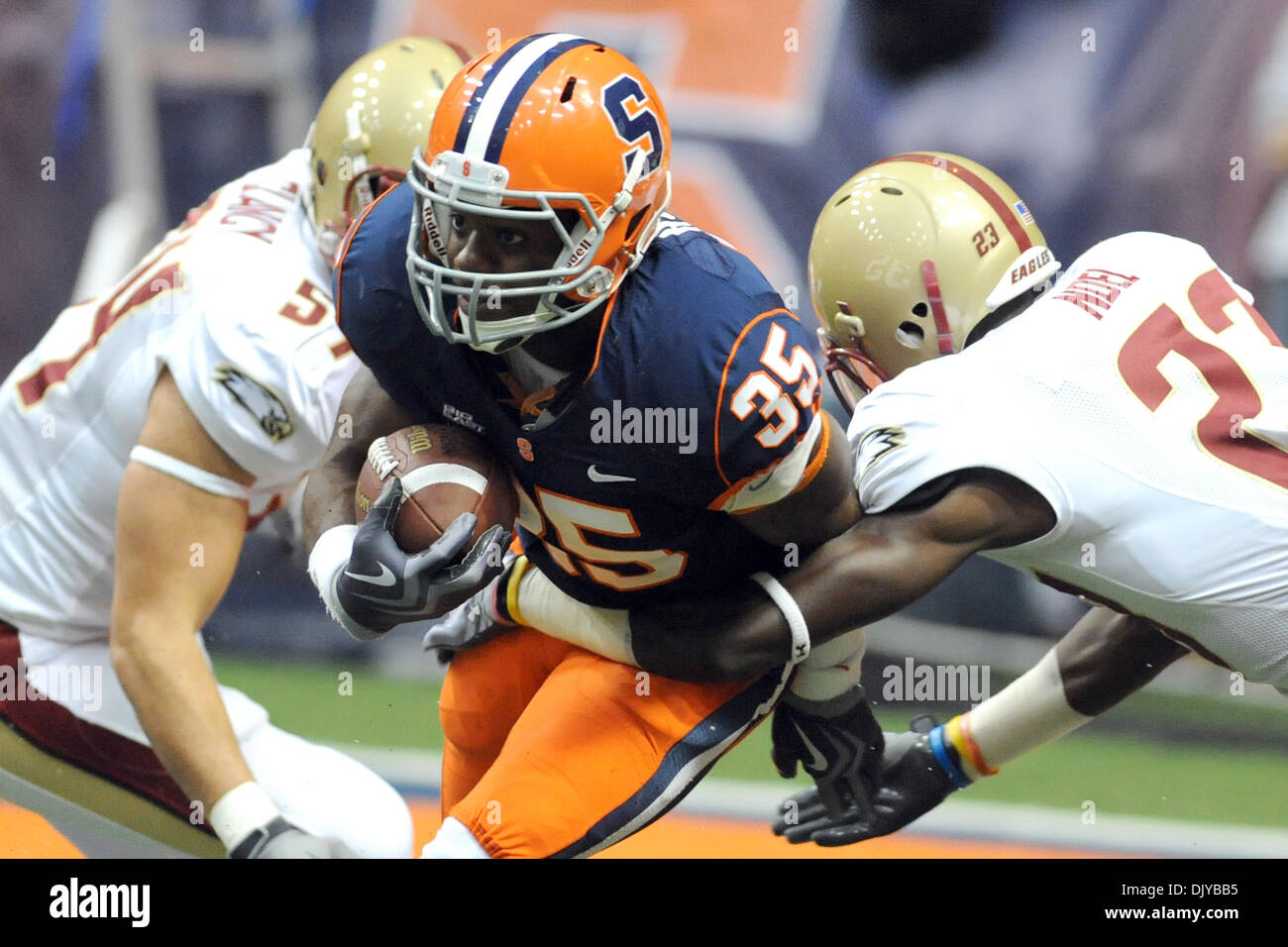 Nov. 27, 2010 - Syracuse, New York, United States of America - Syracuse Orange safety Michael Holmes (35) breaks through the arm tackle by Boston College Eagles cornerback Jim Noel (23) in the fourth quarter while fielding a punt. Boston College defeated Syracuse to qualify for a BCS Bowl game with a final score of 16-7 at the Carrier Dome in Syracuse, New York. (Credit Image: © Mi Stock Photo