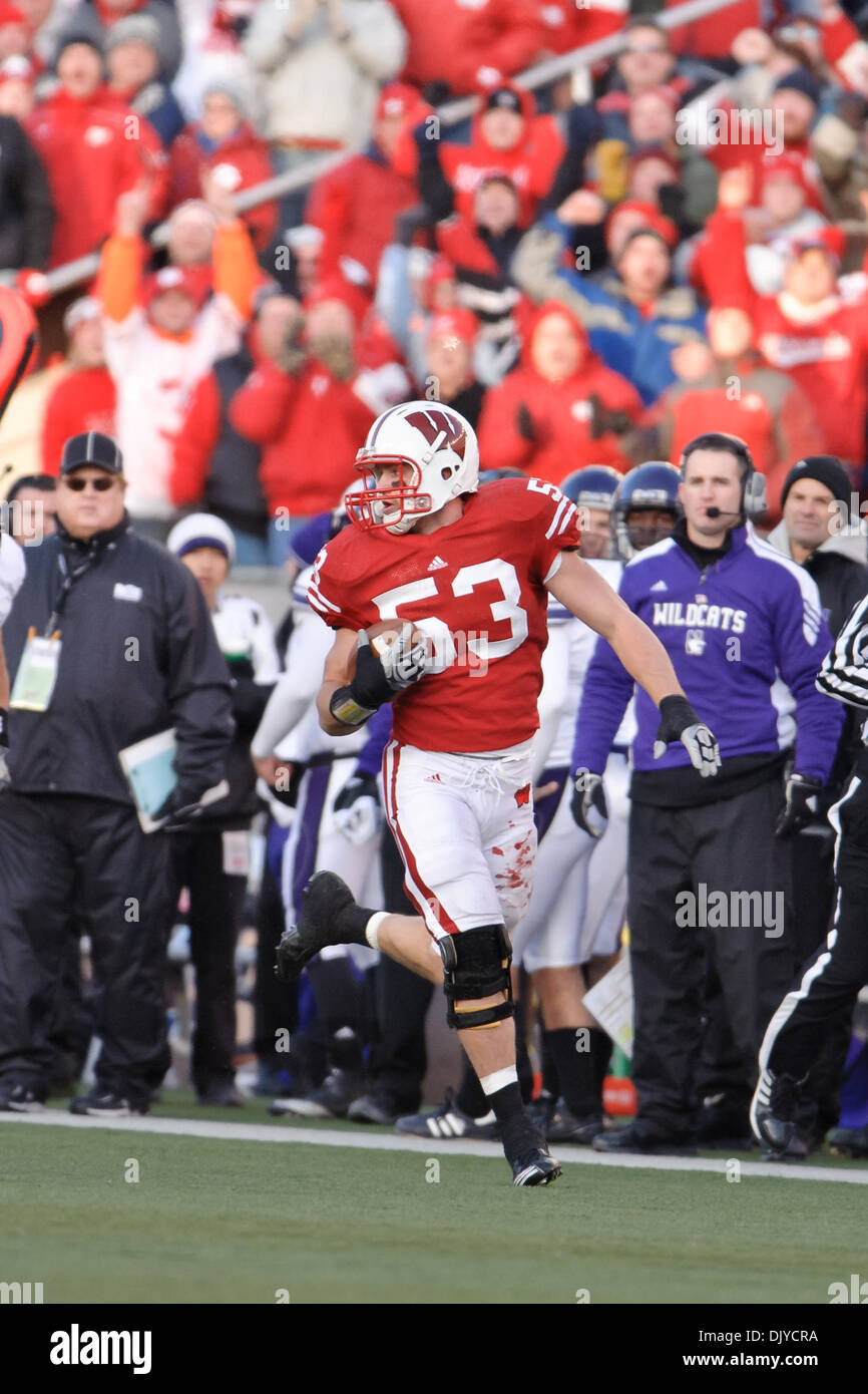 Nov. 27, 2010 - Madison, Wisconsin, United States of America - Wisconsin linebacker Mike Taylor (53) returns an interception during the game between the Wisconsin Badgers and the Northwestern Wildcats at Camp Randall Stadium in Madison, WI.  Wisconsin leads Northwestern at halftime 49-17. (Credit Image: © John Rowland/Southcreek Global/ZUMAPRESS.com) Stock Photo